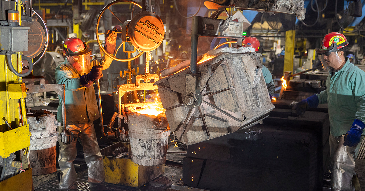 Machinists hard at work in the Bingham & Taylor foundry producing USA cast iron utility access products